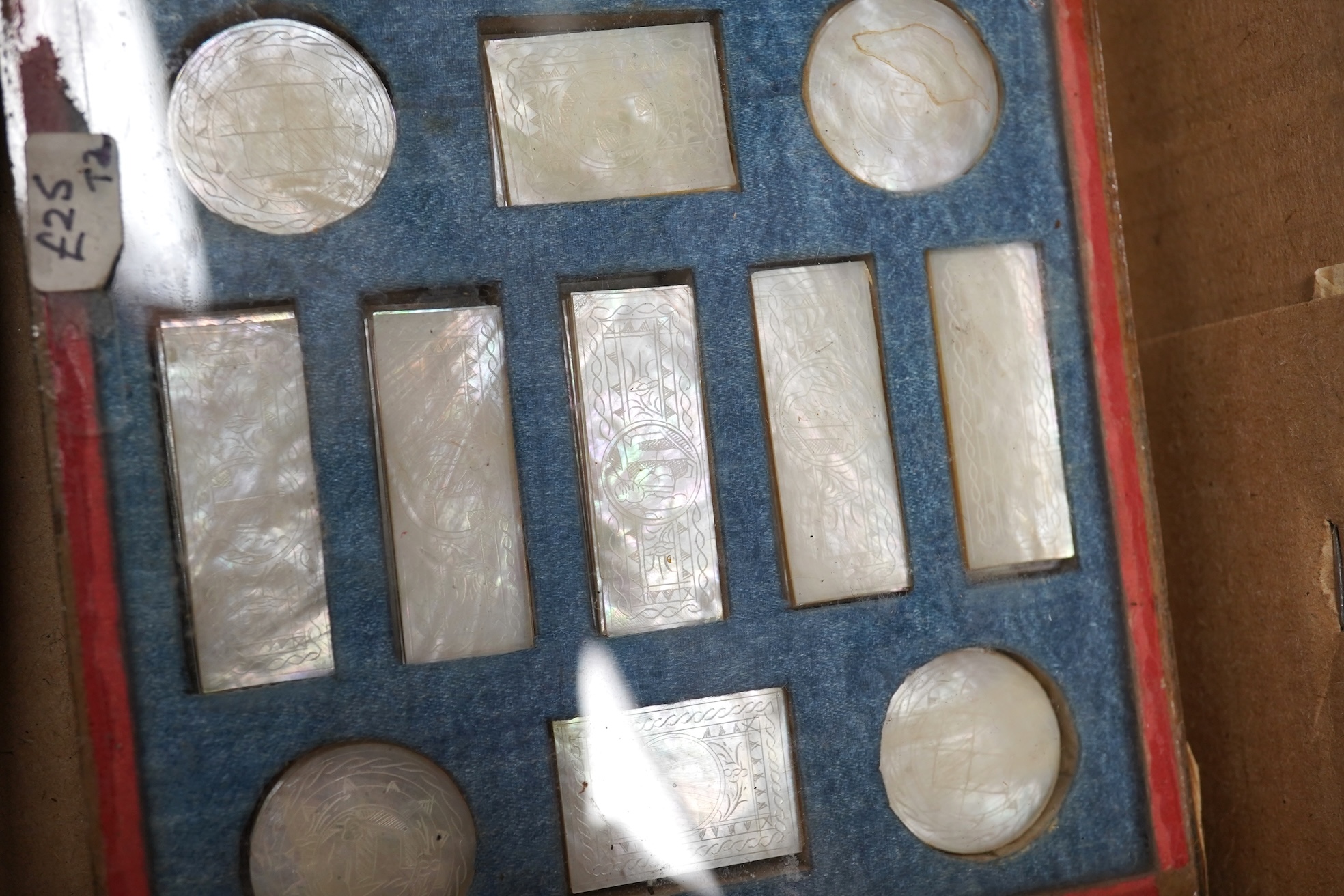 A group of 19th century Chinese mother of pearl gaming counters and accessories, together with a miniature silver cased compass